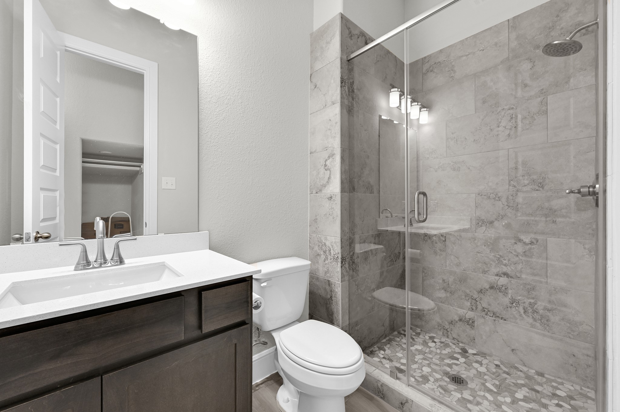 8 Palmero Way Manvel, TX 77578 - Photo 26 of 34 a bathroom with a sink a toilet a mirror and shower