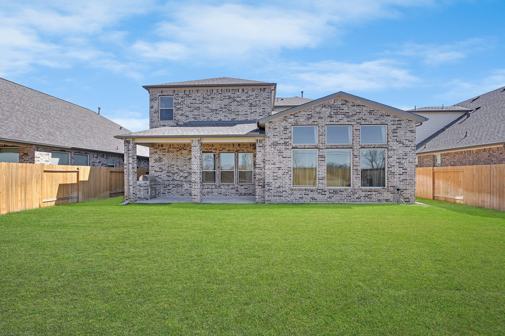 8 Palmero Way Manvel, TX 77578 - Photo 27 of 34 a view of a big house with a big yard and large tree