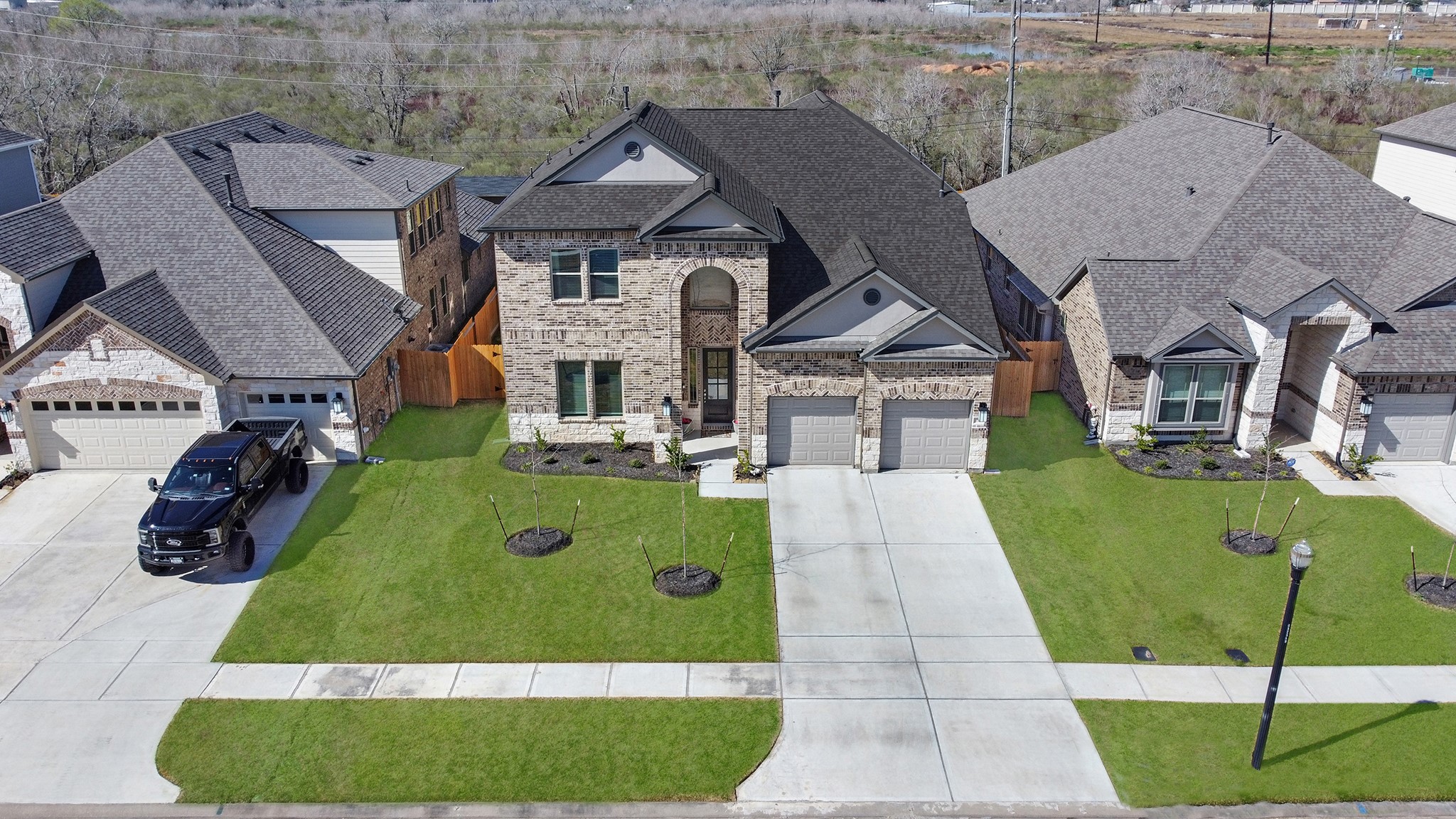 8 Palmero Way Manvel, TX 77578 - Photo 29 of 34 a front view of a house with a garden