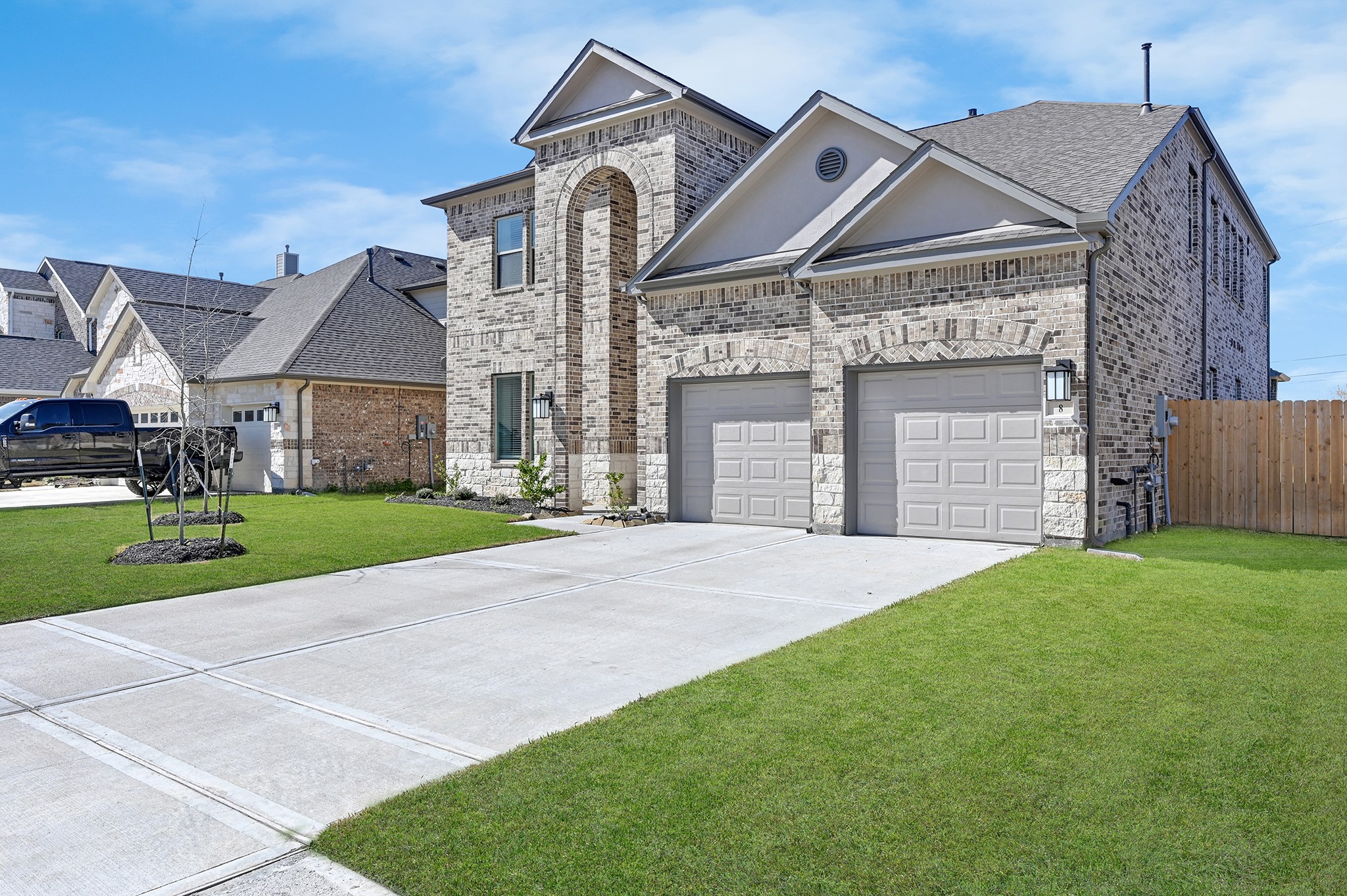 8 Palmero Way Manvel, TX 77578 - Photo 4 of 34 a front view of a house with a yard and garage