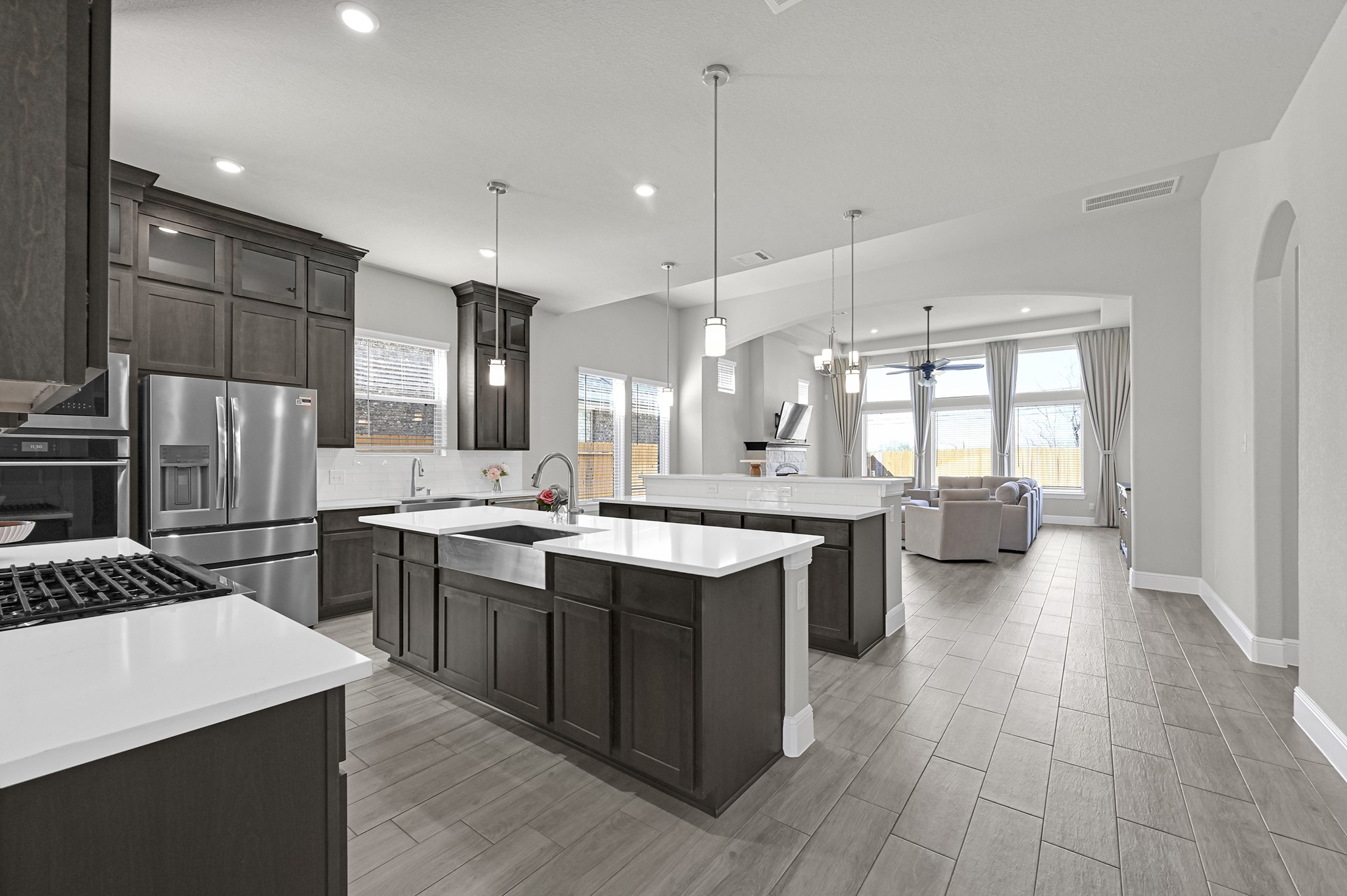 8 Palmero Way Manvel, TX 77578 - Photo 9 of 34 a large kitchen with a large counter top appliances and cabinets