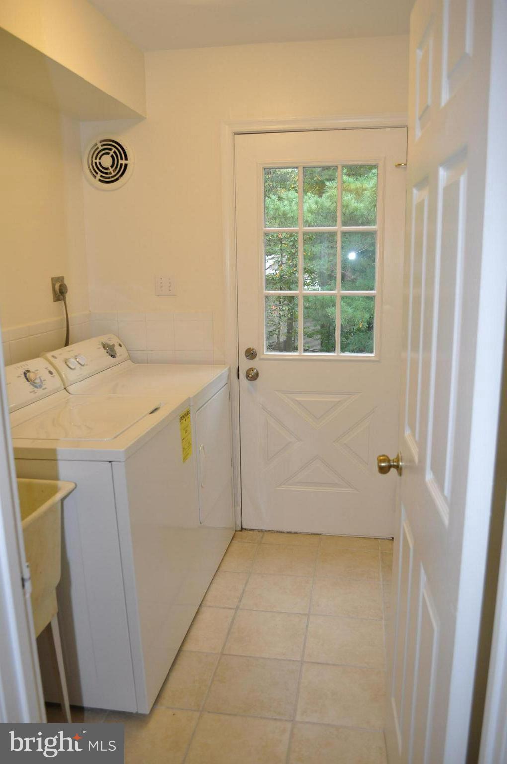 2109 Falling Creek Road Silver Spring, MD 20904 - Photo 9 of 30 Main Level Laundry with door to backyard