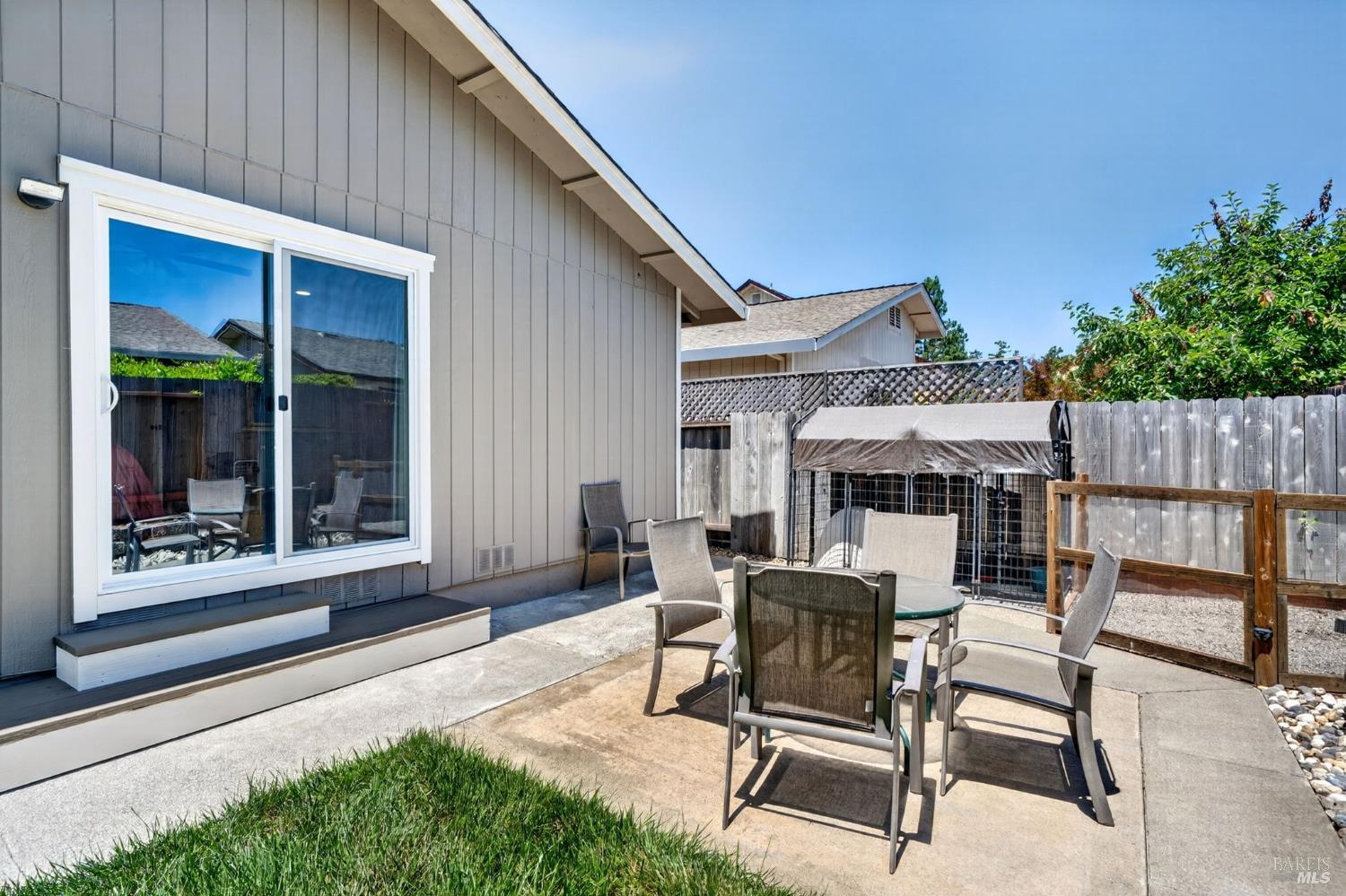 4526 Hillview Court Rohnert Park, CA 94928 - Photo 25 of 28 a view of a patio with table and chairs and potted plants