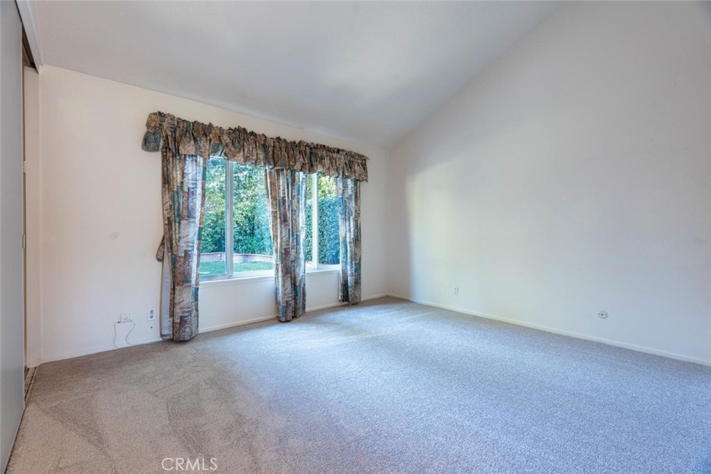 25200 Ave Rotella Valencia, CA 91355 - Photo 9 of 24 a view of an empty room with a sliding door