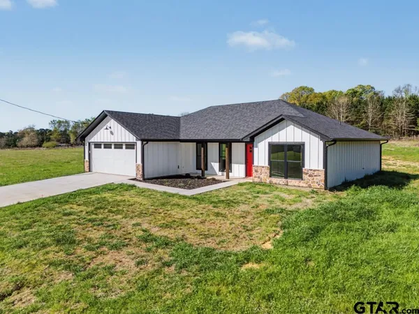 a house view with a garden space