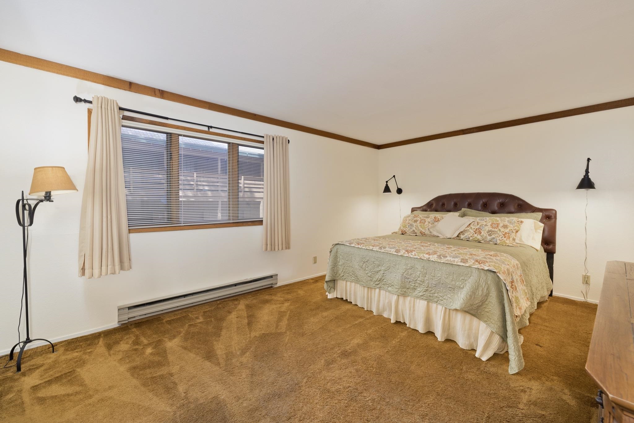 484 Manzanita Road, Unit 16 Mammoth Lakes, CA 93546 - Photo 28 of 34 a bedroom with a bed and a window