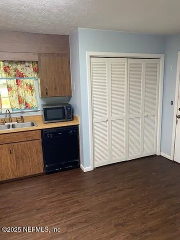 a view of kitchen with wooden floor
