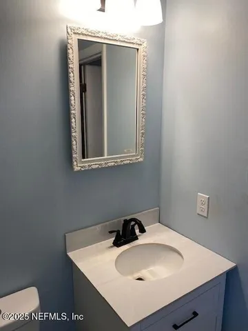 a bathroom with a sink and a vanity