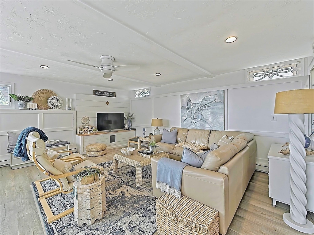 35 Prospect Avenue Hull, MA 02045 - Photo 17 of 42 a living room with furniture a rug and a fireplace