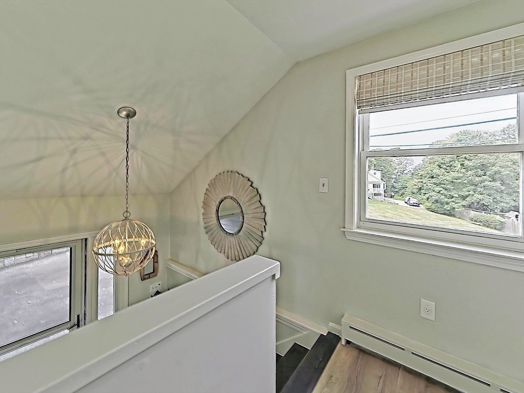 35 Prospect Avenue Hull, MA 02045 - Photo 20 of 42 a view of a room that has a window and a chandelier