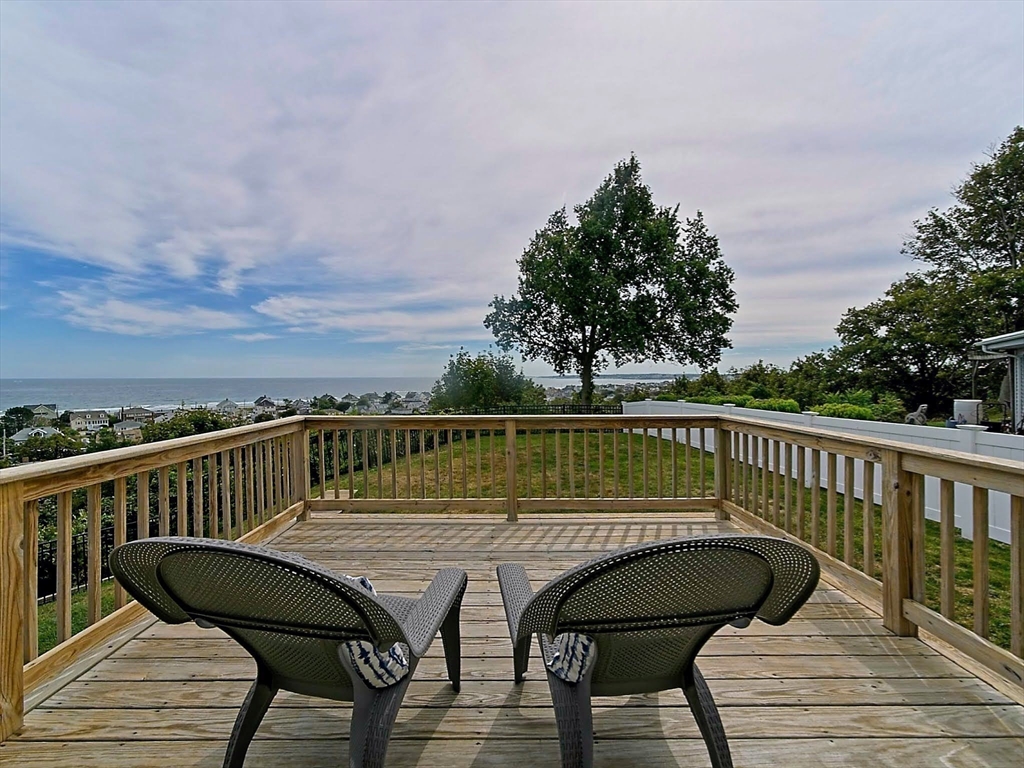 35 Prospect Avenue Hull, MA 02045 - Photo 33 of 42 a view of a roof deck with chair and wooden floor