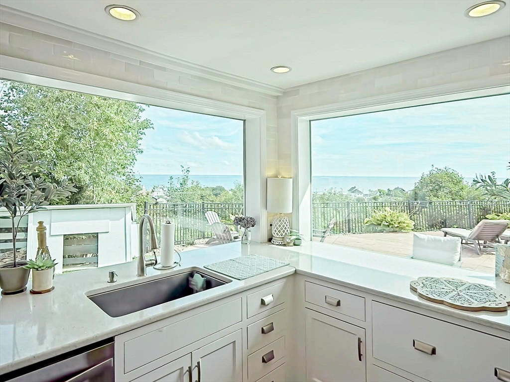 35 Prospect Avenue Hull, MA 02045 - Photo 6 of 42 a living room with furniture and a large window