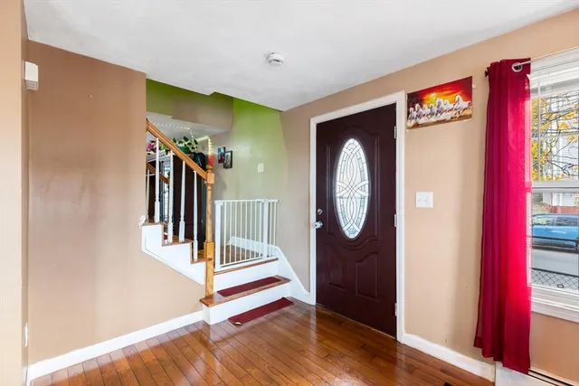 a view of entryway with wooden floor