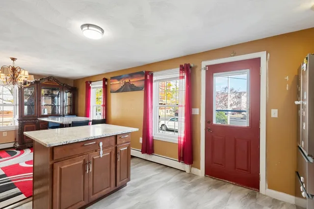 a kitchen with a sink and a large window