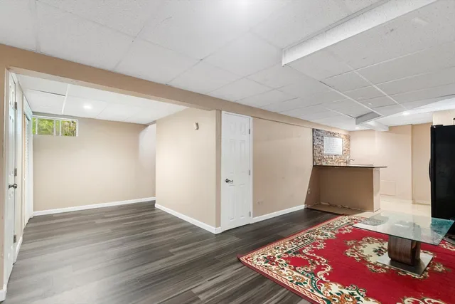 a view of an empty room and wooden floor