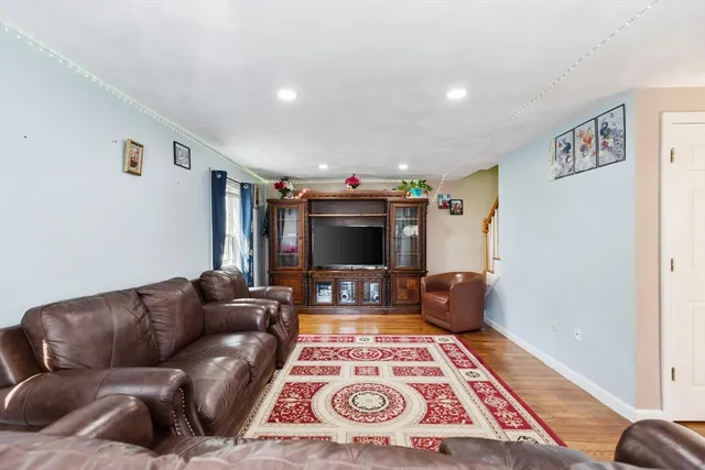 a living room with furniture and a rug