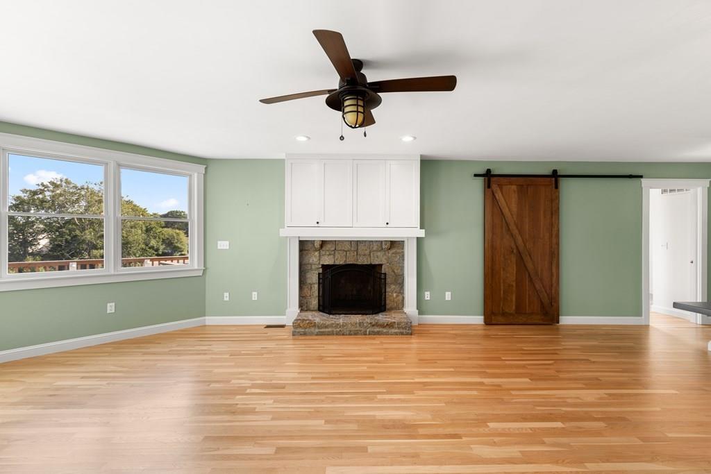 8 Doctors Run Rockport, MA 01966 - Photo 12 of 38 an empty room with windows and a fireplace
