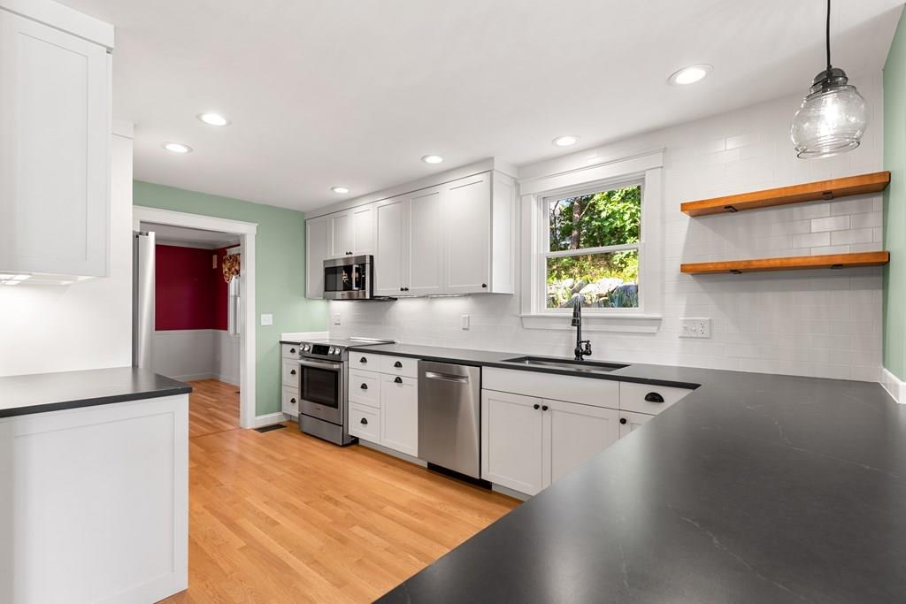 8 Doctors Run Rockport, MA 01966 - Photo 14 of 38 a kitchen with stainless steel appliances granite countertop a sink stove and refrigerator
