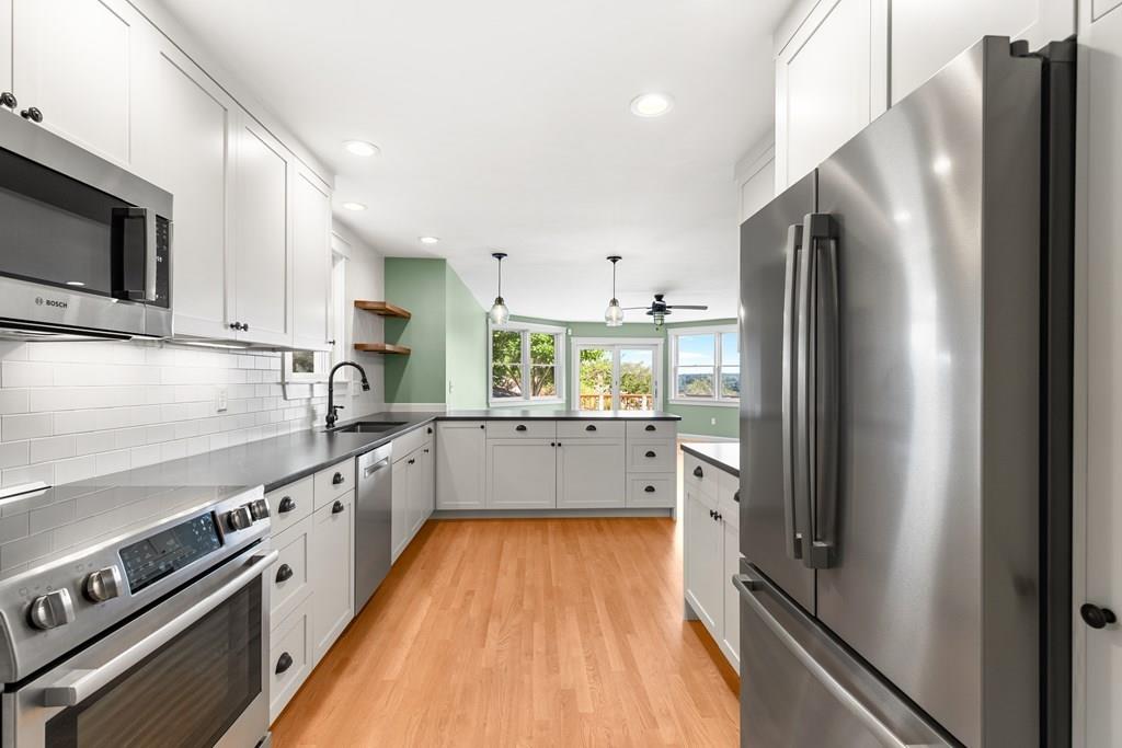 8 Doctors Run Rockport, MA 01966 - Photo 15 of 38 a kitchen with stainless steel appliances a refrigerator sink and stove
