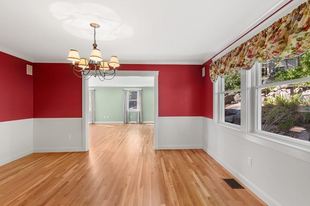 8 Doctors Run Rockport, MA 01966 - Photo 17 of 38 a view of a room with wooden floor staircase and a kitchen