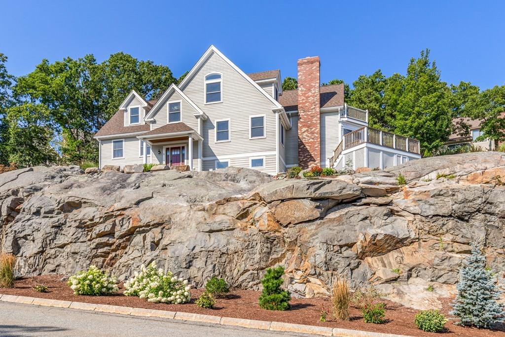 8 Doctors Run Rockport, MA 01966 - Photo 2 of 38 a view of a house with a small yard and large trees