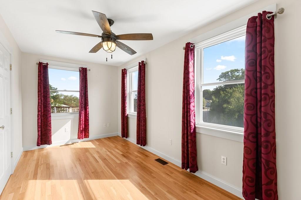 8 Doctors Run Rockport, MA 01966 - Photo 23 of 38 a view of a livingroom with a ceiling fan and wooden floor