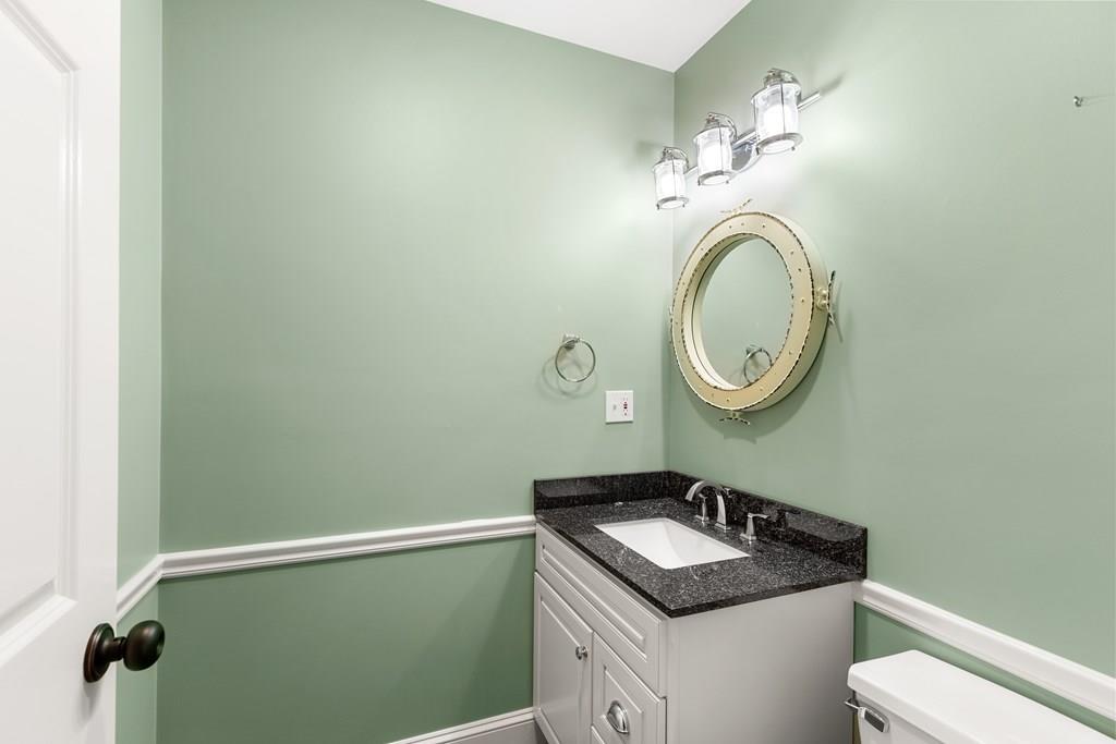 8 Doctors Run Rockport, MA 01966 - Photo 24 of 38 a bathroom with a granite countertop sink and a mirror