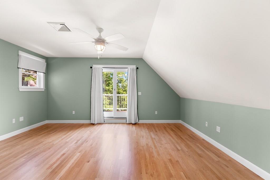 8 Doctors Run Rockport, MA 01966 - Photo 25 of 38 an empty room with wooden floor chandelier fan and windows