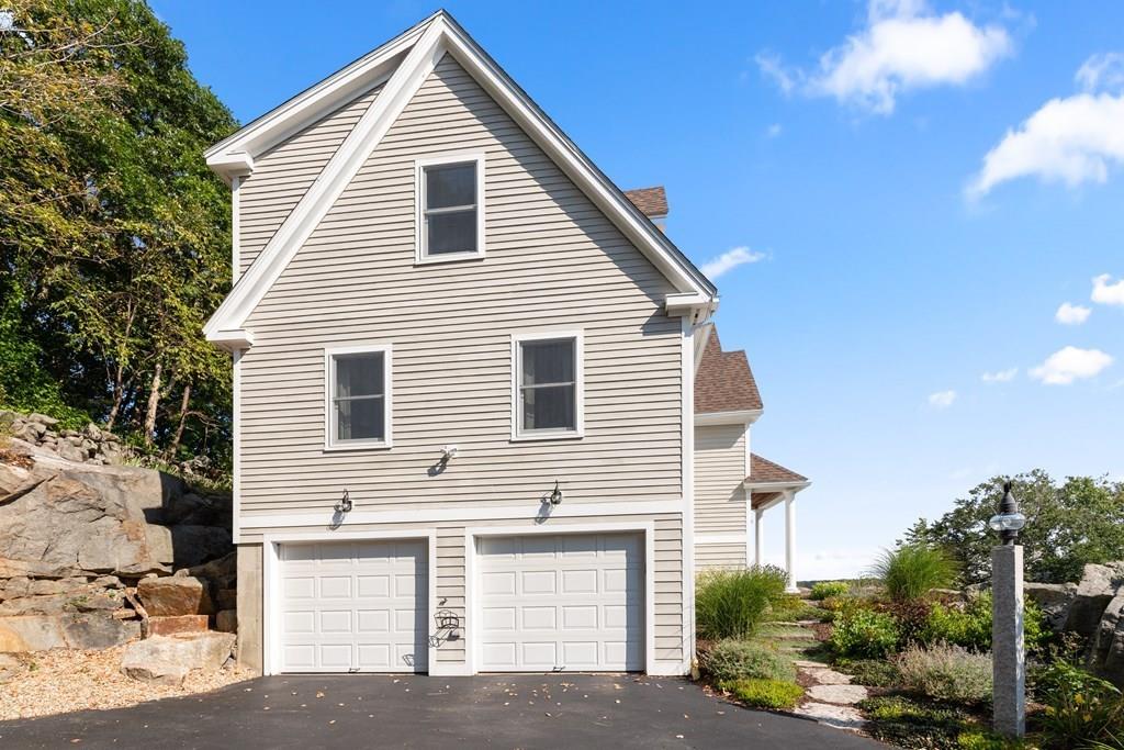 8 Doctors Run Rockport, MA 01966 - Photo 4 of 38 a view of a house with a yard and garage