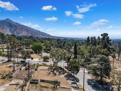 a view of a city with mountains in the background