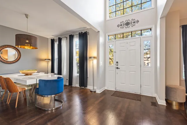 a workspace with wooden floor and a window