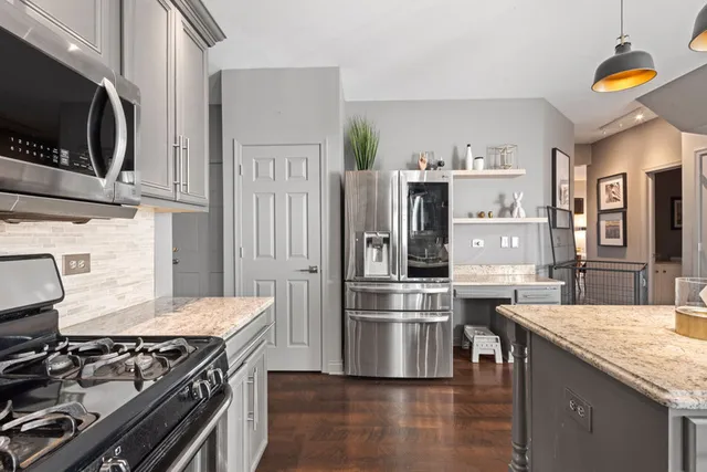 a view of a livingroom with furniture and a kitchen
