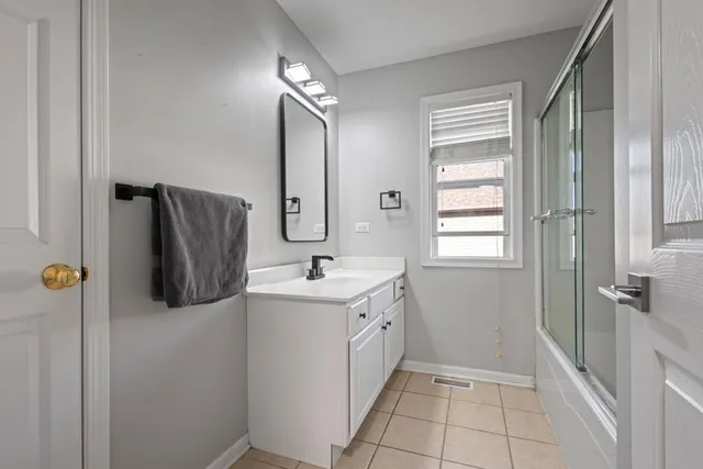 a view of a room with furniture and wooden floor