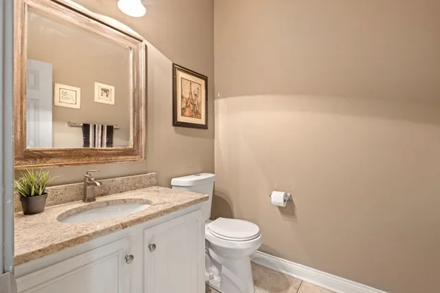 a front view of a house with garden and porch