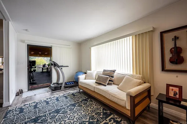 a view of a two chair and tables in the balcony