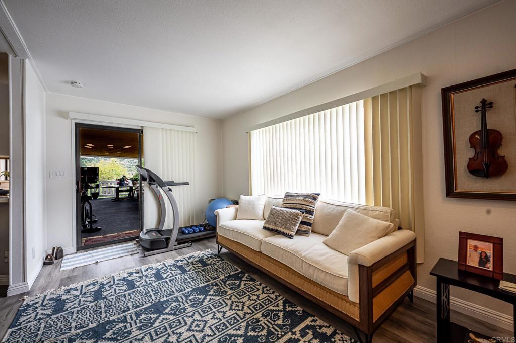 4650 Dulin Road, Unit 229 Fallbrook, CA 92003 - Photo 18 of 53 a living room with furniture and a window