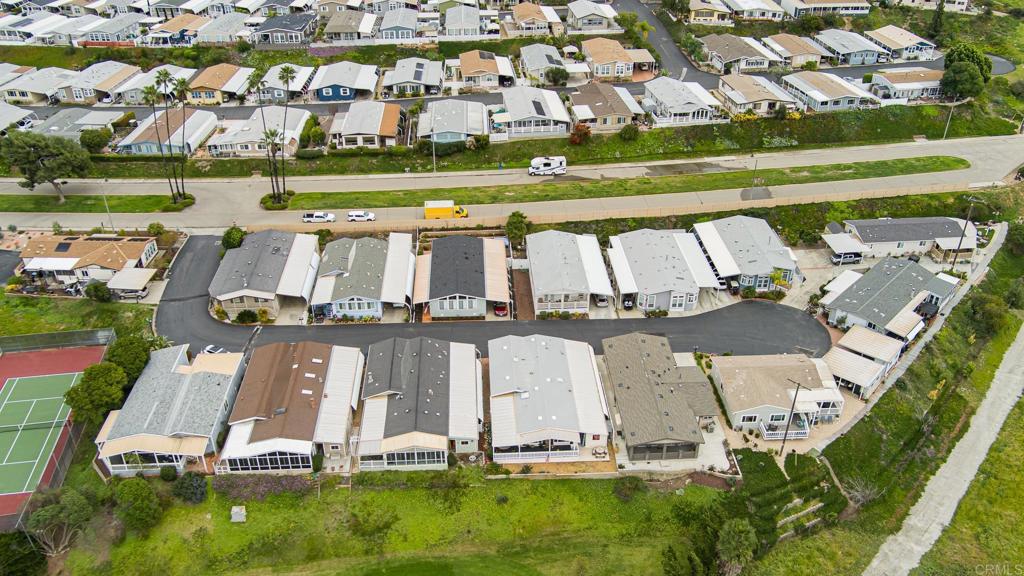 4650 Dulin Road, Unit 229 Fallbrook, CA 92003 - Photo 32 of 53 an aerial view of a house with a garden and lake view