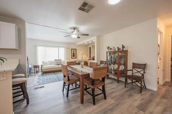 a bedroom with a bed a chair and window