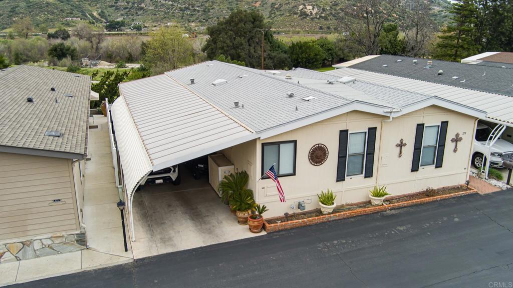 4650 Dulin Road, Unit 229 Fallbrook, CA 92003 - Photo 40 of 53 an aerial view of a house with roof deck front of house