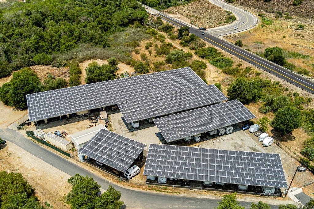4650 Dulin Road, Unit 229 Fallbrook, CA 92003 - Photo 52 of 53 a view of a roof deck with wooden floor and fence