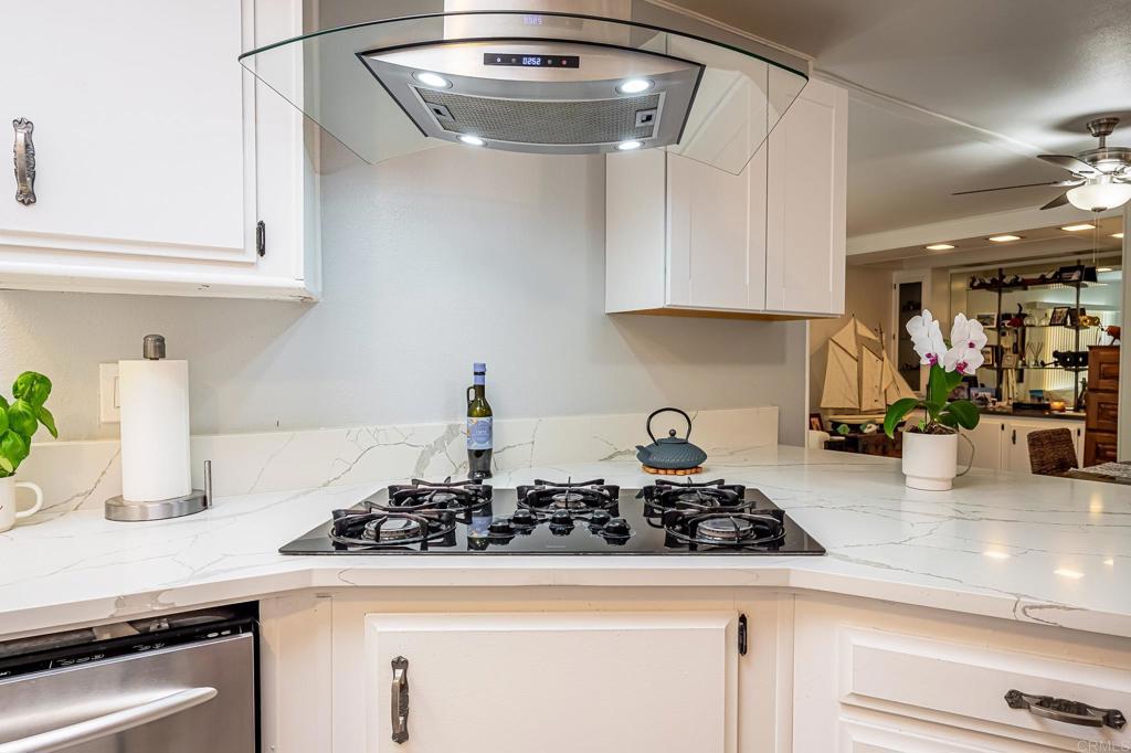 4650 Dulin Road, Unit 229 Fallbrook, CA 92003 - Photo 8 of 53 a kitchen with a sink a stove and cabinets