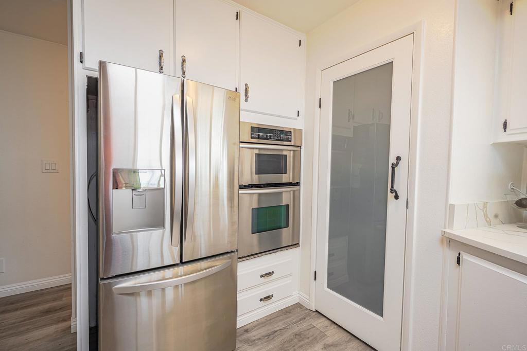 4650 Dulin Road, Unit 229 Fallbrook, CA 92003 - Photo 10 of 53 a kitchen with stainless steel appliances a refrigerator and cabinets