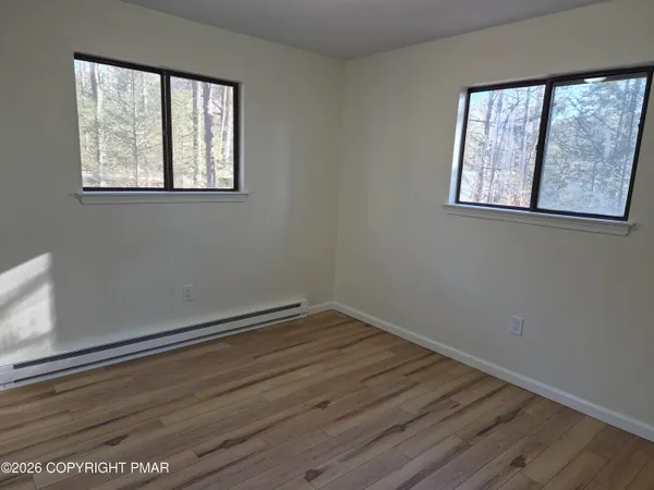 wooden floor and closet in a room