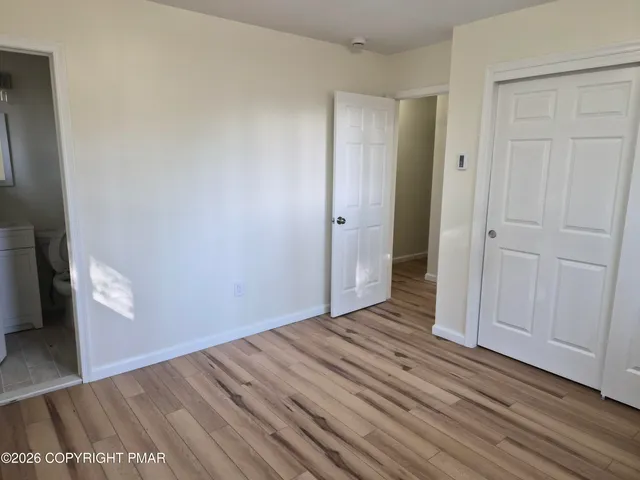 a white toilet sitting next to a white sink