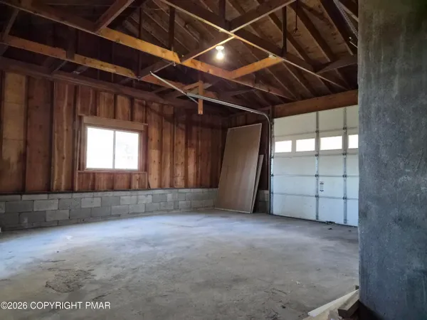 a view of an empty room with a fireplace