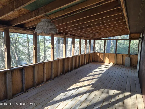 a view of gallery with wooden floor