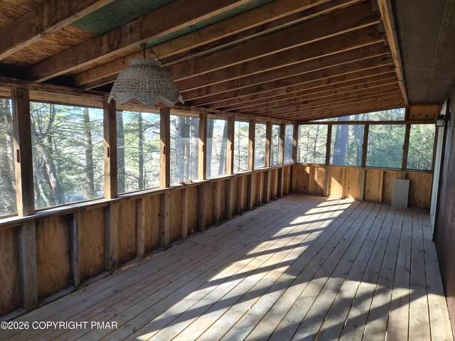 a view of gallery with wooden floor