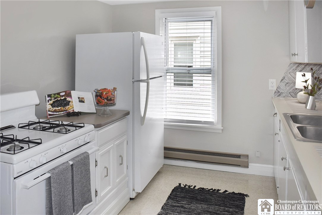 79 Pershing Avenue Jamestown, NY 14701 - Photo 11 of 31 Whit and Bright Kitchen 2nd floor apartment