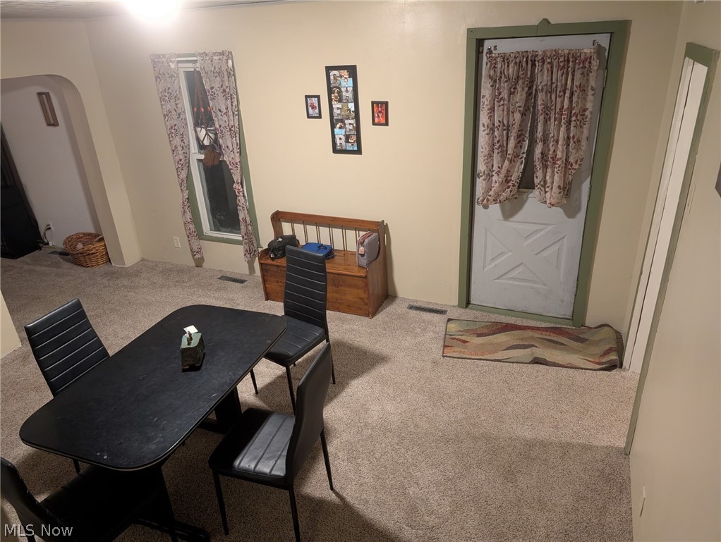 3 South 2nd Street Dennison, OH 44621 - Photo 7 of 16 Dining space featuring arched walkways and carpet