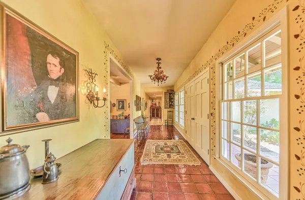 a view of a sink and a table in a kitchen